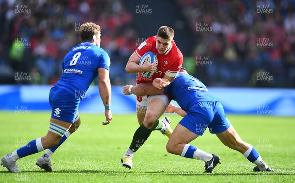 110323 - Italy v Wales - Guinness Six Nations - Joe Hawkins of Wales takes on Lorenzo Cannone and Michele Lamaro of Italy