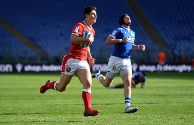 130321 - Italy v Wales - Guinness Six Nations - Louis Rees-Zammit of Wales breaks through