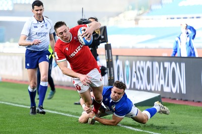 130321 - Italy v Wales - Guinness Six Nations - Josh Adams of Wales is tackled by Mattia Bellini of Italy