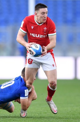 130321 - Italy v Wales - Guinness Six Nations - Josh Adams of Wales is tackled by Paolo Garbisi of Italy