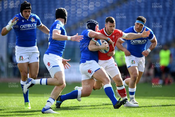 130321 - Italy v Wales - Guinness Six Nations - Gareth Davies of Wales is tackled by Luca Bigi of Italy