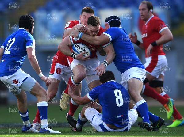 130321 - Italy v Wales - Guinness Six Nations - George North of Wales is tackled by Michele Lamaro and Luca Bigi of Italy