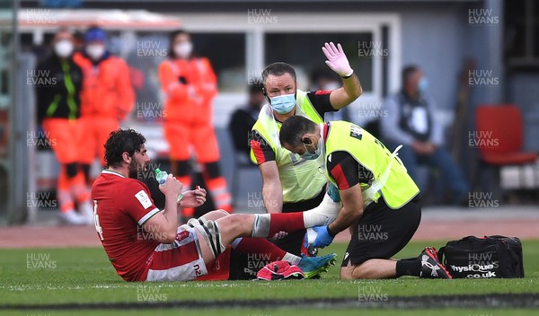 130321 - Italy v Wales - Guinness Six Nations - Cory Hill of Wales is treated by Geoff Davies and John Miles