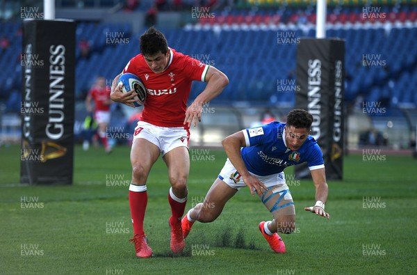 130321 - Italy v Wales - Guinness Six Nations - Louis Rees-Zammit of Wales takes on Jacopo Trulla of Italy