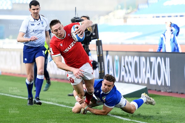 130321 - Italy v Wales - Guinness Six Nations - Josh Adams of Wales is tackled by Mattia Bellini of Italy