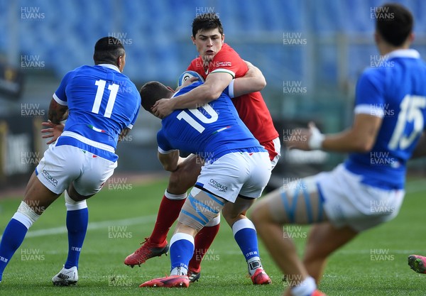 130321 - Italy v Wales - Guinness Six Nations - Louis Rees-Zammit of Wales is tackled by Paolo Garbisi of Italy