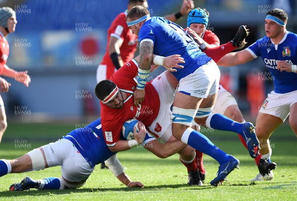 130321 - Italy v Wales - Guinness Six Nations - Wyn Jones of Wales is tackled by Johan Meyer and Niccolo Cannone of Italy
