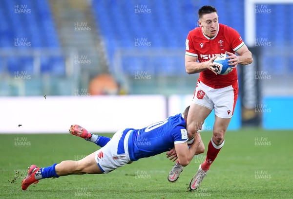 130321 - Italy v Wales - Guinness Six Nations - Josh Adams of Wales is tackled by Paolo Garbisi of Italy