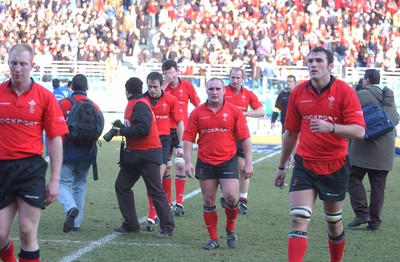 150203 - Italy v Wales - Six Nations Championship - Wales players leave the field dejected  