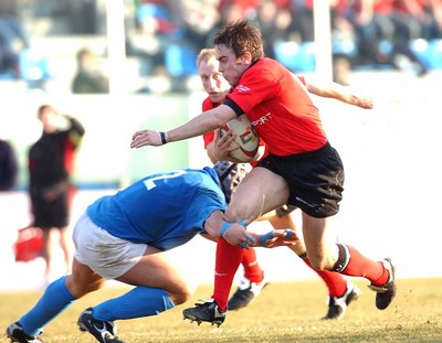 150203 - Italy v Wales - Six Nations Championship -  Wales' Rhys Williams is tackled by Carlo Festuccia  