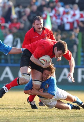 150203 - Italy v Wales - Six Nations Championship -  Wales' Michael Owen is brought down by Diego Dominguez  