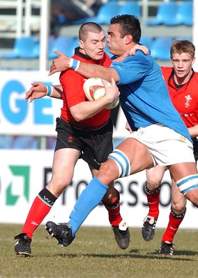 150203 - Italy v Wales - Six Nations Championship -  Wales' Iestyn Harris is tackled by Christian Bezzi  