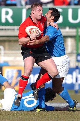 150203 - Italy v Wales - Six Nations Championship -  Wales' Leigh Davies is stopped by Cristian Stoica  