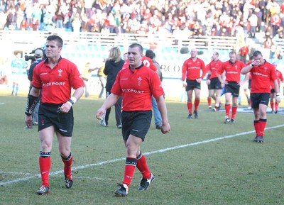 150203 - Italy v Wales - Six Nations Championship - Wales' Ceri Sweeney and Iestyn Harris leave the field dejected