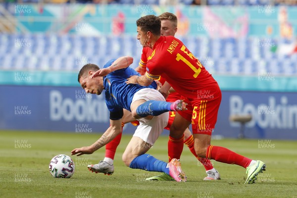 200621 - Italy v Wales - Euro 2020, Group A - Andrea Belotti of Italy is tackled by Ethan Ampadu of Wales