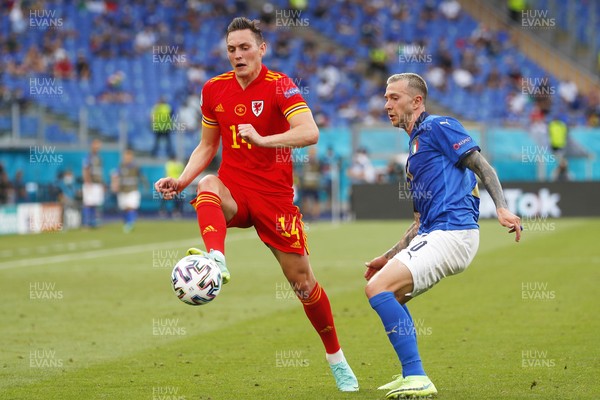 200621 - Italy v Wales - Euro 2020, Group A - Connor Roberts of Wales is challenged by Federico Bernardeschi