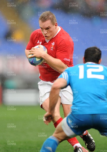 230213 - Italy v Wales - RBS Six Nations -Gethin Jenkins of Wales is tackled by Gonzalo Canale of Italy