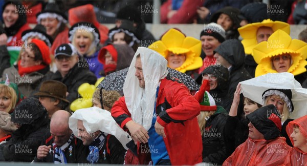 230213 - Italy v Wales - RBS Six Nations -Wales fans enjoy the rain