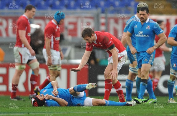 230213 - Italy v Wales - RBS Six Nations -Dan Biggar of Wales shows his regret for a late challenge on Kristopher Burton of Italy