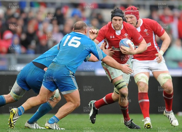 230213 - Italy v Wales - RBS Six Nations -Ryan Jones of Wales is tackled by Davide Giazzon of Italy