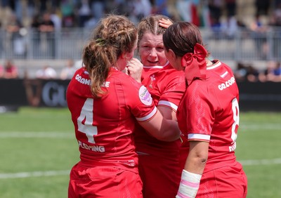 270425 - Italy v Wales, Guinness Women’s Six Nations 2025 - Abbie Fleming of Wales, Kate Williams of Wales and Georgia Evans of Wales at the end of the match
