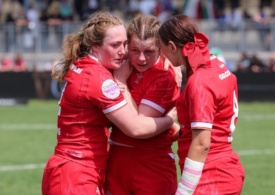 270425 - Italy v Wales, Guinness Women’s Six Nations 2025 - Abbie Fleming of Wales, Kate Williams of Wales and Georgia Evans of Wales at the end of the match
