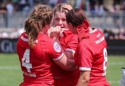 270425 - Italy v Wales, Guinness Women’s Six Nations 2025 - Abbie Fleming of Wales, Kate Williams of Wales and Georgia Evans of Wales at the end of the match