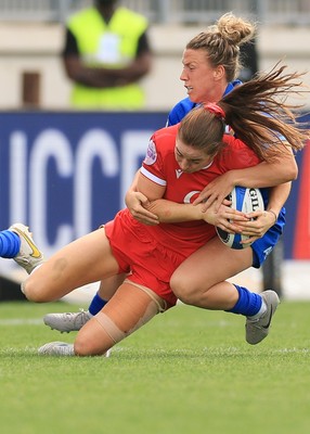 270425 - Italy v Wales, Guinness Women’s Six Nations 2025 - Lisa Neumann of Wales is tackled by Francesca Sgorbini of Italy