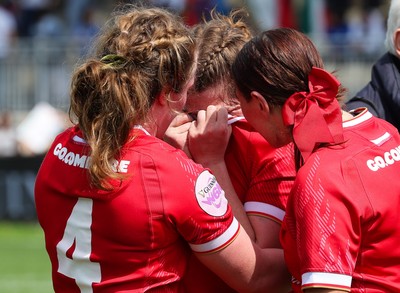 270425 - Italy v Wales, Guinness Women’s Six Nations 2025 - Kate Williams of Wales, Abbie Fleming of Wales and Georgia Evans of Wales at the end of the match