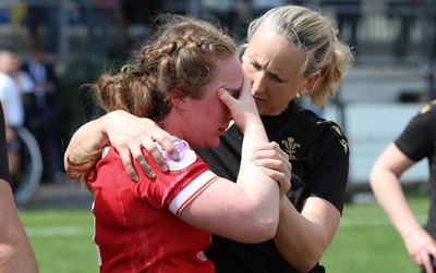 270425 - Italy v Wales, Guinness Women’s Six Nations 2025 - Abbie Fleming of Wales with medic Jo Perkins at the end of the match