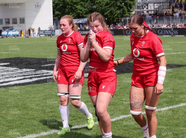 270425 - Italy v Wales, Guinness Women’s Six Nations 2025 - Abbie Fleming of Wales, Kate Williams of Wales and Georgia Evans of Wales at the end of the match