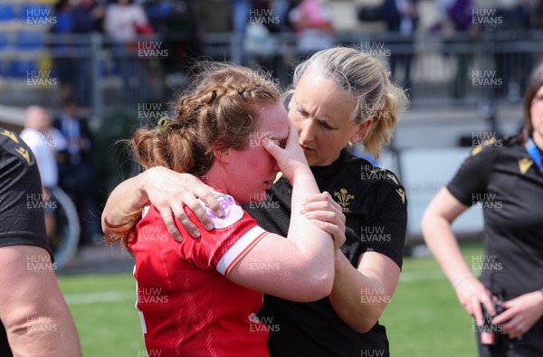 270425 - Italy v Wales, Guinness Women’s Six Nations 2025 - Abbie Fleming of Wales with medic Jo Perkins at the end of the match