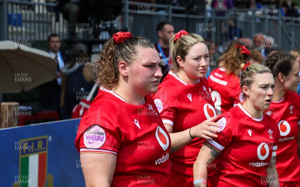 270425 - Italy v Wales, Guinness Women’s Six Nations 2025 - Gwenllian Pyrs of Wales, Gwen Crabb of Wales and Keira Bevan of Wales at the end of the match