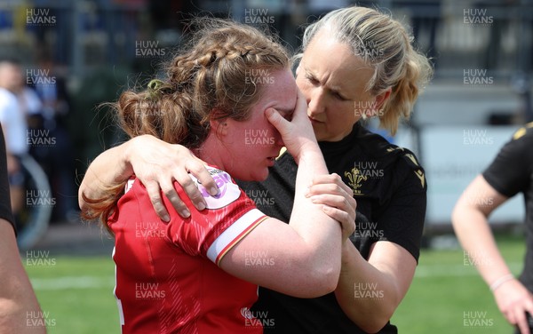 270425 - Italy v Wales, Guinness Women’s Six Nations 2025 - Abbie Fleming of Wales with medic Jo Perkins at the end of the match