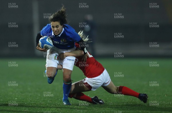 090219 - Italy v Wales - Guinness Women's Six Nations -  Manuela Furlan of Italy is tackled by Elinor Snowsill of Wales