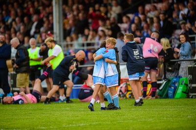 100622 - James Hook Select XV v Classic Lions XV - James Hook Testimonial Match - James Hook's son, Harrison, celebrates kicking a conversion