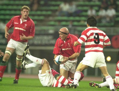 060601 - Japan Select XV v Wales - Nathan Budgett offloads to Andy Moore as Tetsuro Miyashita tackles