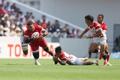 050725 - Japan v Wales - Summer Tour First Test - Taulupe Faletau of Wales is tackled by Takuro Matsunaga of Japan 