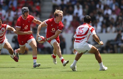 050725 - Japan v Wales - Summer Tour First Test - Blair Murray of Wales is challenged by Takuro Matsunaga of Japan 
