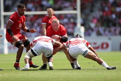 050725 - Japan v Wales - Summer Tour First Test - Keiron Assiratti of Wales is tackled by Yota Kamimori and Mamoru Harada of Japan 