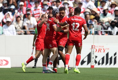 050725 - Japan v Wales - Summer Tour First Test - Tom Rogers of Wales celebrates scoring a try with team mates