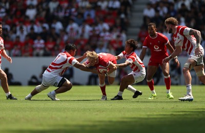 050725 - Japan v Wales - Summer Tour First Test - Blair Murray of Wales is tackled by Yota Kamimori and Shinobu Fujiwara of Japan 