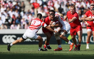 050725 - Japan v Wales - Summer Tour First Test - Liam Belcher of Wales is tackled by Shuhei Takeuchi of Japan 