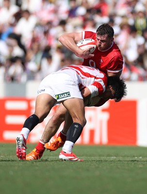 050725 - Japan v Wales - Summer Tour First Test - James Ratti of Wales is tackled by Ichigo Nakakusu of Japan 