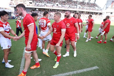 050725 - Japan v Wales - Summer Tour First Test - Sam Costelow of Wales shakes hands with the opposition at full time