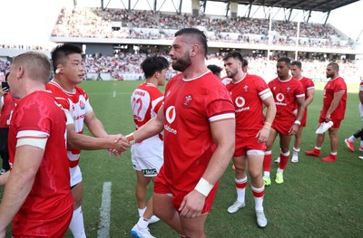 050725 - Japan v Wales - Summer Tour First Test - Gareth Thomas of Wales shakes hands with the opposition at full time