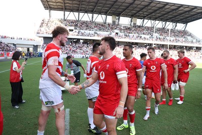 050725 - Japan v Wales - Summer Tour First Test - Joe Roberts of Wales shakes hands with the opposition at full time