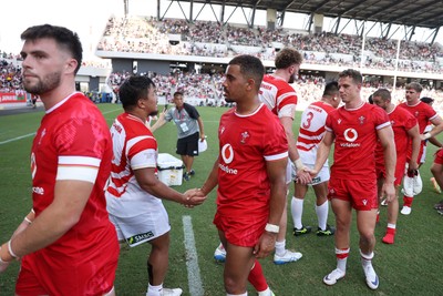 050725 - Japan v Wales - Summer Tour First Test - Ben Thomas of Wales shakes hands with the opposition at full time