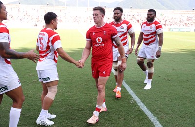 050725 - Japan v Wales - Summer Tour First Test - Josh Adams of Wales shakes hands with the opposition at full time