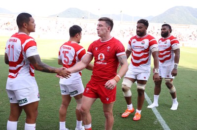 050725 - Japan v Wales - Summer Tour First Test - Josh Adams of Wales shakes hands with the opposition at full time